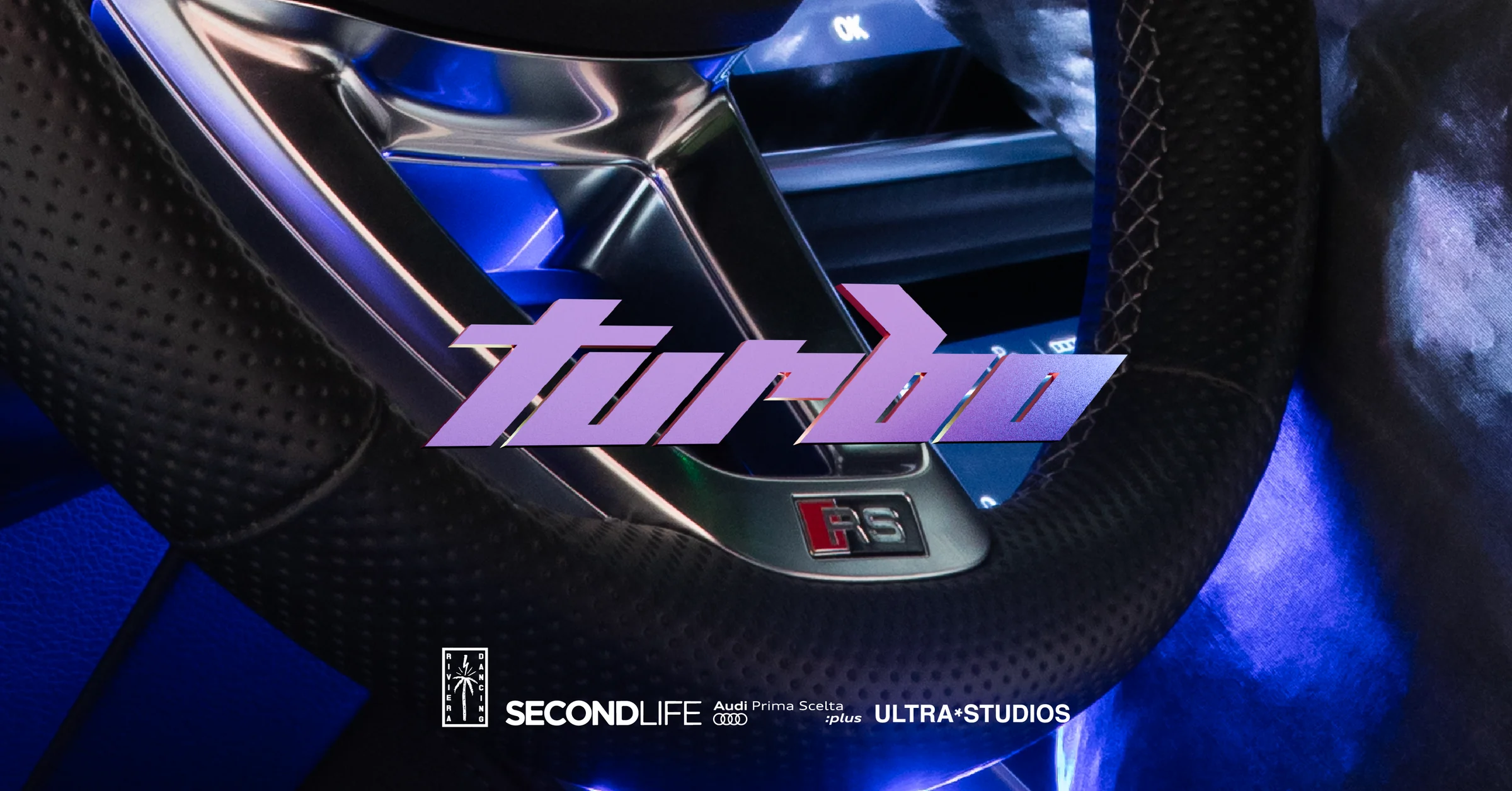 Copertina di Turbo: il logo viola sul volante in luce blu